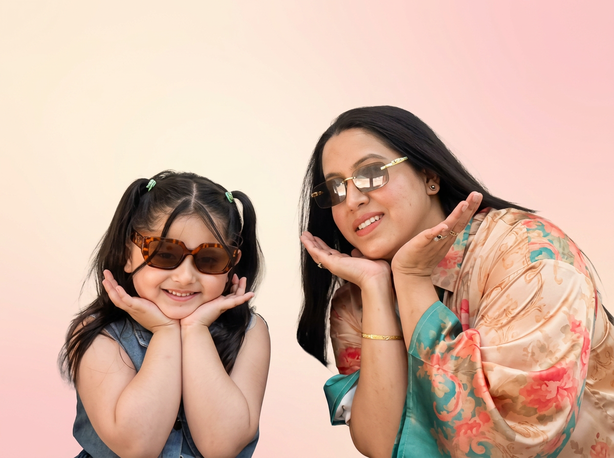 A parent and child laughing while creating together